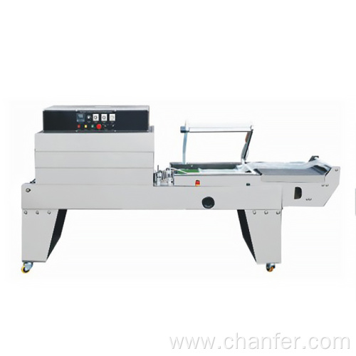 Continuous seal-cut- shrink packaging machine